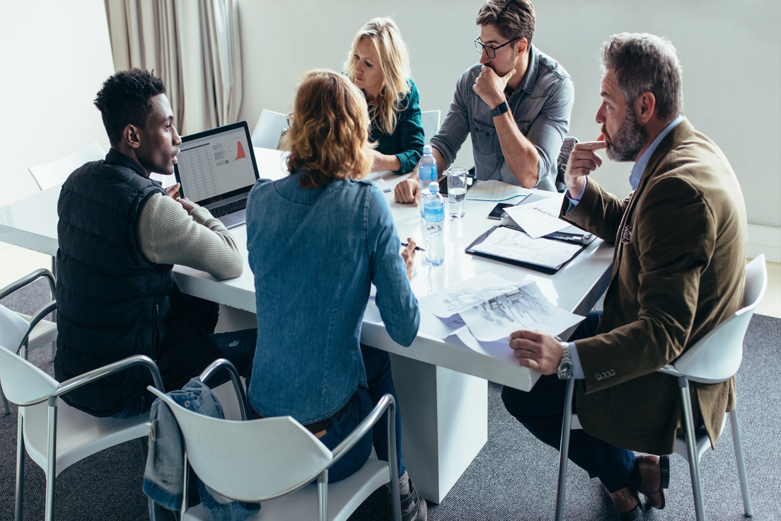 group of managers discussing project