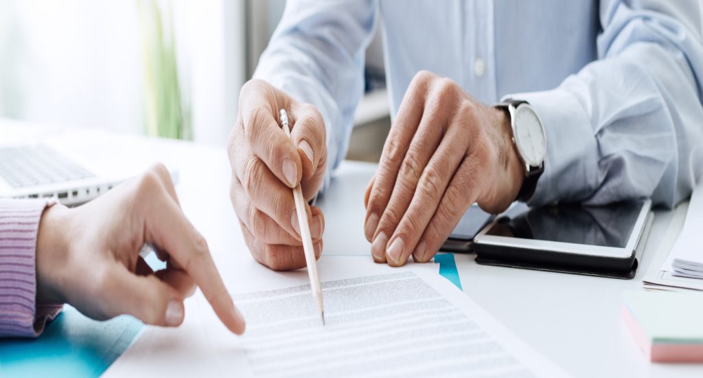 Business-people-reviewing-contract Business-people-reviewing-contract